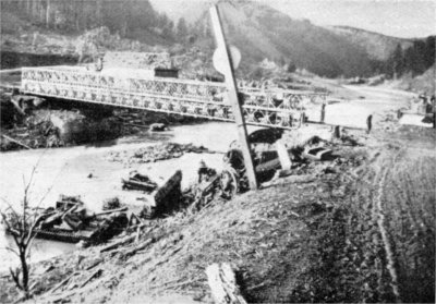Bailey bridge, German wreckage, at the Our river