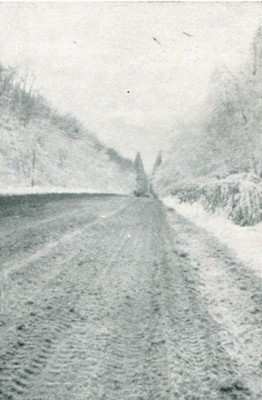 Snow-covered road to Bastogne from Metzert