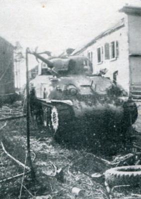 Swastika-painted American medium tank near Wschweiler. It was one used by the Nazis in teir winter lunge